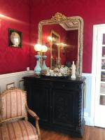 a room with a vanity with a mirror and a chair at VICHY LUXE NAPOLEON III in Vichy