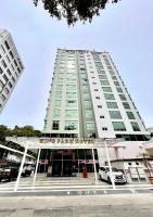 a tall building with a car parked in front of it at King Park Hotel Kota Kinabalu in Kota Kinabalu