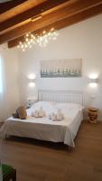 A bed or beds in a room at Agriturismo Resort Il Foionco