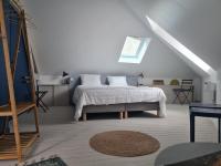 a white bedroom with a bed and a window at Les 3 Graces, Cayeux-sur-mer, agréable maison in Cayeux-sur-Mer