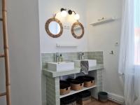 a bathroom with two sinks and two mirrors at Les 3 Graces, Cayeux-sur-mer, agréable maison in Cayeux-sur-Mer