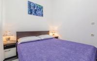 Posteľ alebo postele v izbe v ubytovaní Apartmani Ivanković