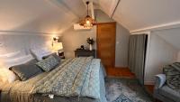 Cama ou camas em um quarto em La Plonploniere