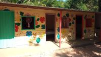 a house with a painting on the side of it at Pousada Grão in Belém