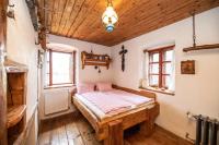 Postel nebo postele na pokoji v ubytování Domek kata Matěje