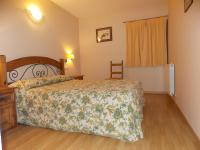 Postel nebo postele na pokoji v ubytování Apartamentos Fidalgo