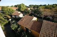 an overhead view of roofs of houses in a village at Pavillon, de 4 à 7 couchages, dans une superbe résidence avec piscine in Soustons
