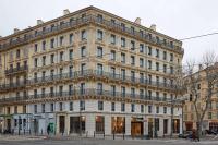 a large building on the corner of a street at NH Collection Marseille in Marseille