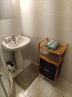 a bathroom with a sink and a toilet and a sink at Très joli Studio refait à neuf au calme in Saint-Martin-Vésubie