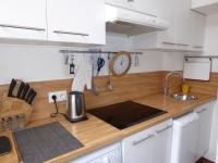 A kitchen or kitchenette at L&#39;Annexe Apparth&ocirc;tel du 11 C, 3 &eacute;toiles