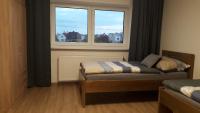 Postel nebo postele na pokoji v ubytování Vila Věkoše - apartmán s terasou a zahradou
