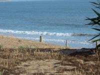 a sandy beach with the ocean in the background at Gîte Le Bernard, 6 pièces, 10 personnes - FR-1-426-164 in Le Bernard