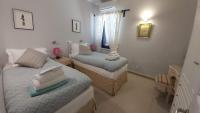 Posteľ alebo postele v izbe v ubytovaní Villa Quietude