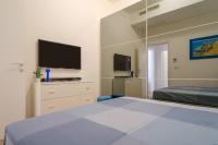 A bed or beds in a room at Appartamento Fico D'india