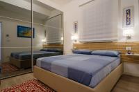 A bed or beds in a room at Appartamento Fico D'india
