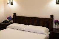 Una cama o camas en una habitaci&oacute;n de Hotel Rural Casa de Campo