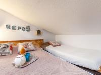 a bedroom with two beds and a tray of food on the bed at Studio Rond Point des Pistes-19 by Interhome in Tignes