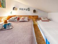 two twin beds in a room with at Studio Rond Point des Pistes-19 by Interhome in Tignes