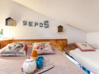 a room with two beds and a sign that says keep at Studio Rond Point des Pistes-19 by Interhome in Tignes