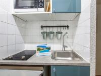 a kitchen counter with a sink and a box on it at Studio Rond Point des Pistes-19 by Interhome in Tignes