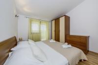 En eller flere senge i et v&aelig;relse p&aring; Martini in Vrsine - Haus f&uuml;r 8 Personen