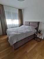 Posteľ alebo postele v izbe v ubytovaní Apartman ARIA