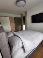 Posteľ alebo postele v izbe v ubytovaní Apartman ARIA