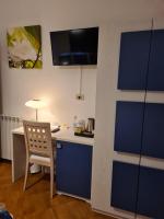 Televízia a/alebo spoločenská miestnosť v ubytovaní Albis Rooms Guest House