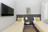 Televízia a/alebo spoločenská miestnosť v ubytovaní Słoneczne Tarasy II - Apartments