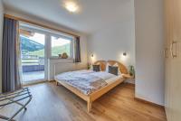 Łóżko lub łóżka w pokoju w obiekcie Am Zwölferkogel Appartements