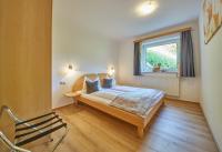 Łóżko lub łóżka w pokoju w obiekcie Am Zwölferkogel Appartements