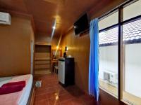 Postel nebo postele na pokoji v ubytování Rainbow Bungalow Haadrin Koh Phangan