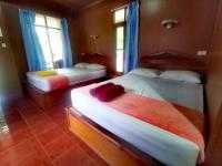 Postel nebo postele na pokoji v ubytování Rainbow Bungalow Haadrin Koh Phangan