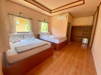 Postel nebo postele na pokoji v ubytování Rainbow Bungalow Haadrin Koh Phangan