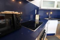 A kitchen or kitchenette at Espectacular vivienda con piscina climatizada