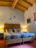 Łóżko lub łóżka w pokoju w obiekcie Alpin Resort Kaprun 14