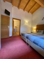Łóżko lub łóżka w pokoju w obiekcie Alpin Resort Kaprun 14