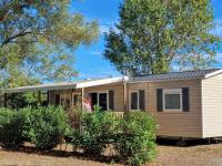a manufactured home with a modular house at Mobile home De Luxe St Cyprien in Saint-Cyprien
