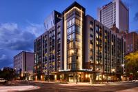 a large building with many windows on a city street at Hyatt Place Phoenix&#47;Downtown in Phoenix