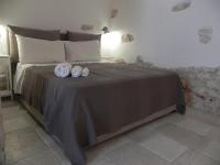 Łóżko lub łóżka w pokoju w obiekcie Casa Gioia Ostuni
