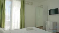 Postel nebo postele na pokoji v ubytování Angelina Hotel