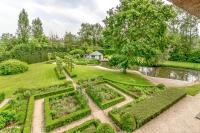 an aerial view of a garden with a pond at Raesborre in Leuven
