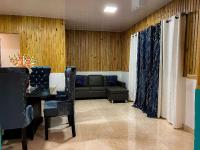 Posezení v ubytování Alaia Casa de campo By Hospedify Para 10 personas en la naturaleza con BBQ cerca de rió cristalino