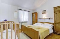 Postel nebo postele na pokoji v ubytování Maslina in Popovići (Haus für 5-7 Personen)