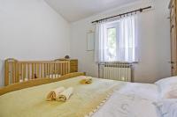 Postel nebo postele na pokoji v ubytování Maslina in Popovići (Haus für 5-7 Personen)