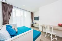 Postel nebo postele na pokoji v ubytování LullaBella Hotel Patong