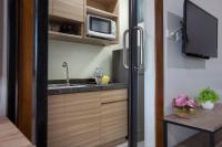 Kuchyň nebo kuchyňský kout v ubytování Be Live Residence
