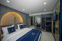 A bed or beds in a room at Hotel California
