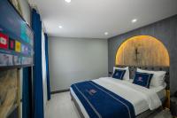 A bed or beds in a room at Hotel California