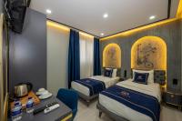 A bed or beds in a room at Hotel California